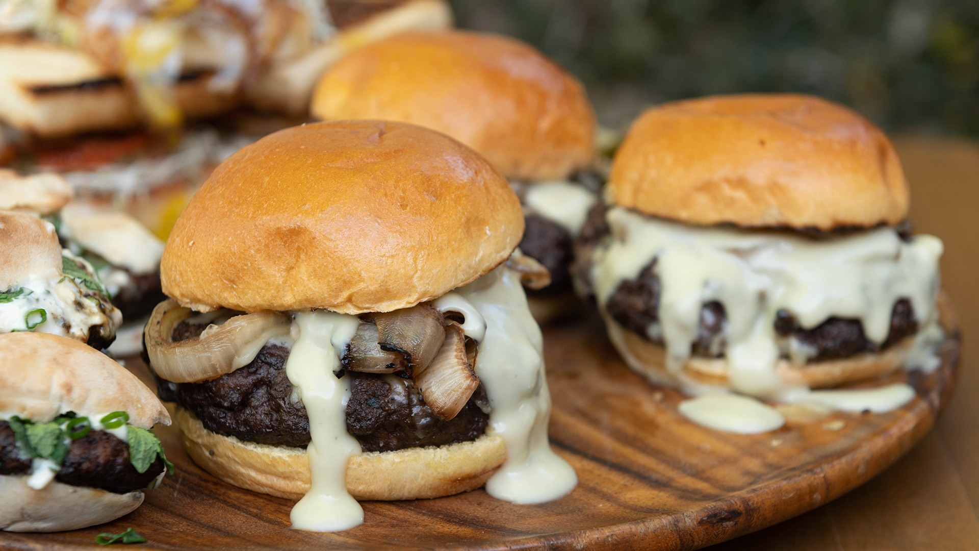 Brisket Burger with Grilled Onions and Blue Cheese Sauce | Tastemade