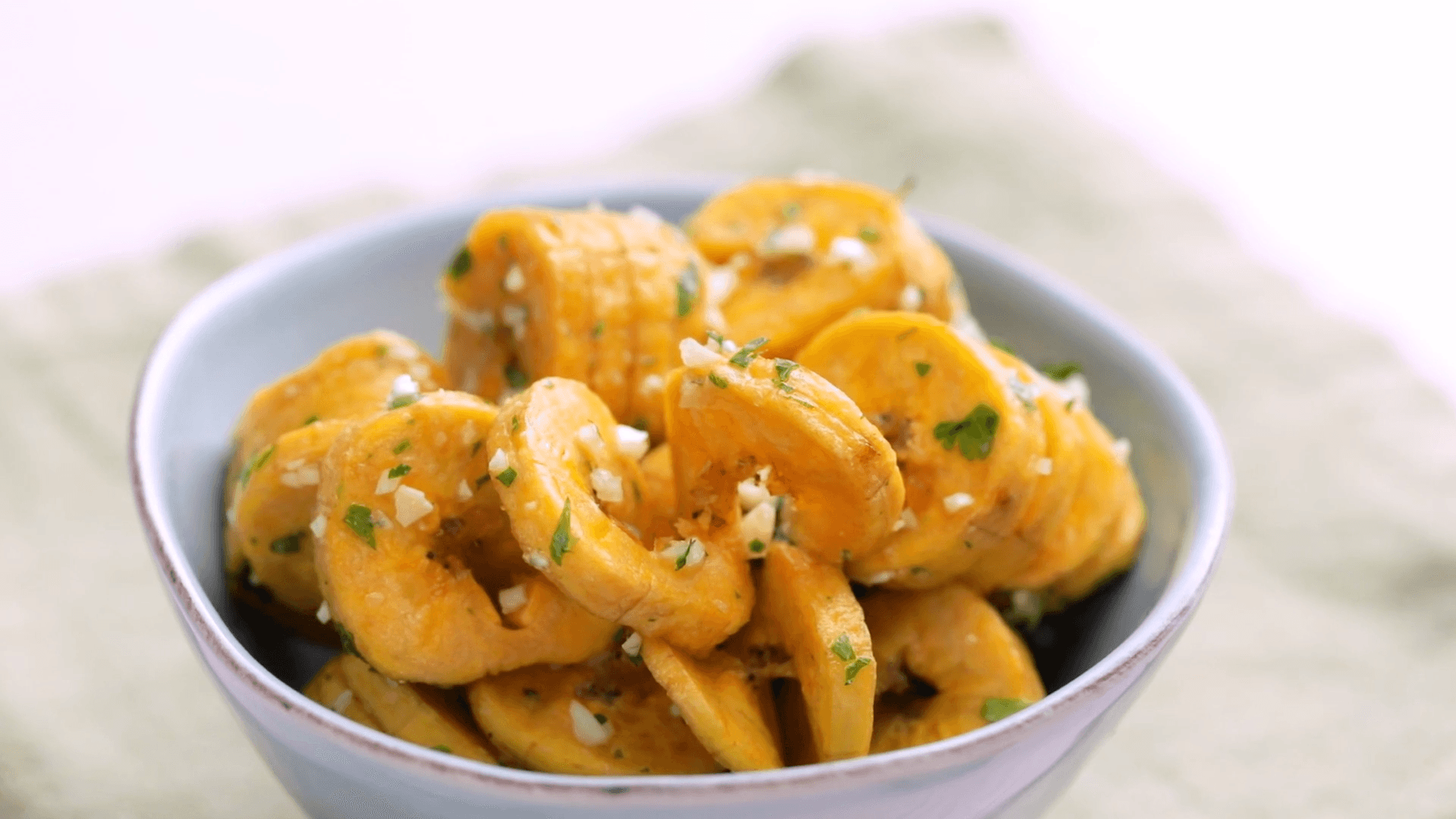 Garlic & Herb Plantain Curly “Fries” With Creamy Cotija Sauce Tastemade